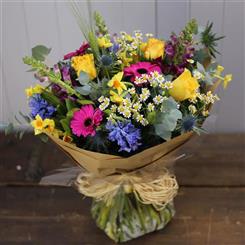 A SCENTED SPRING HANDTIED florist choice