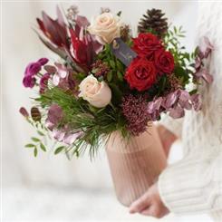         A FESTIVE VASE ARRANGEMENT 